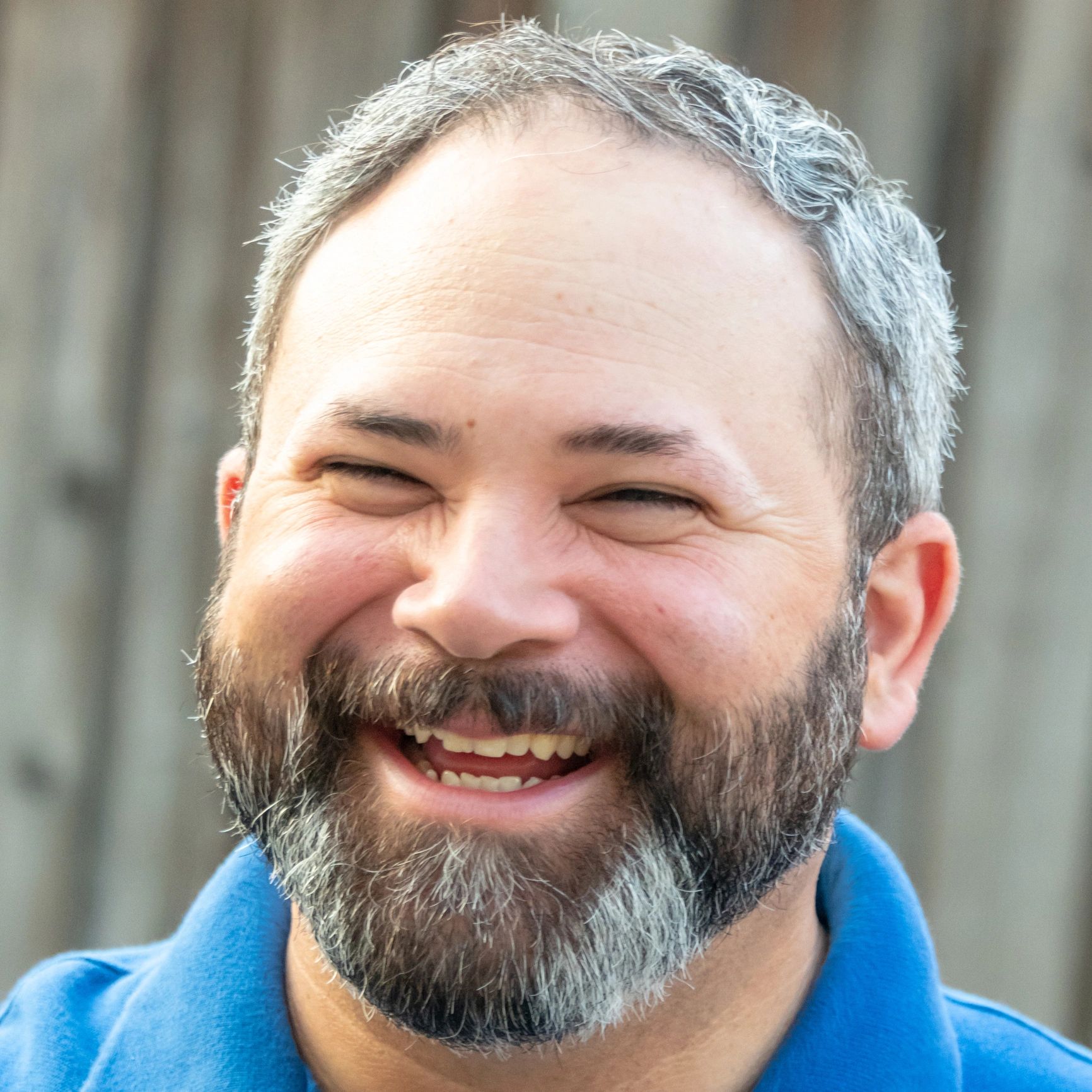 Headshot of a smiling professional man