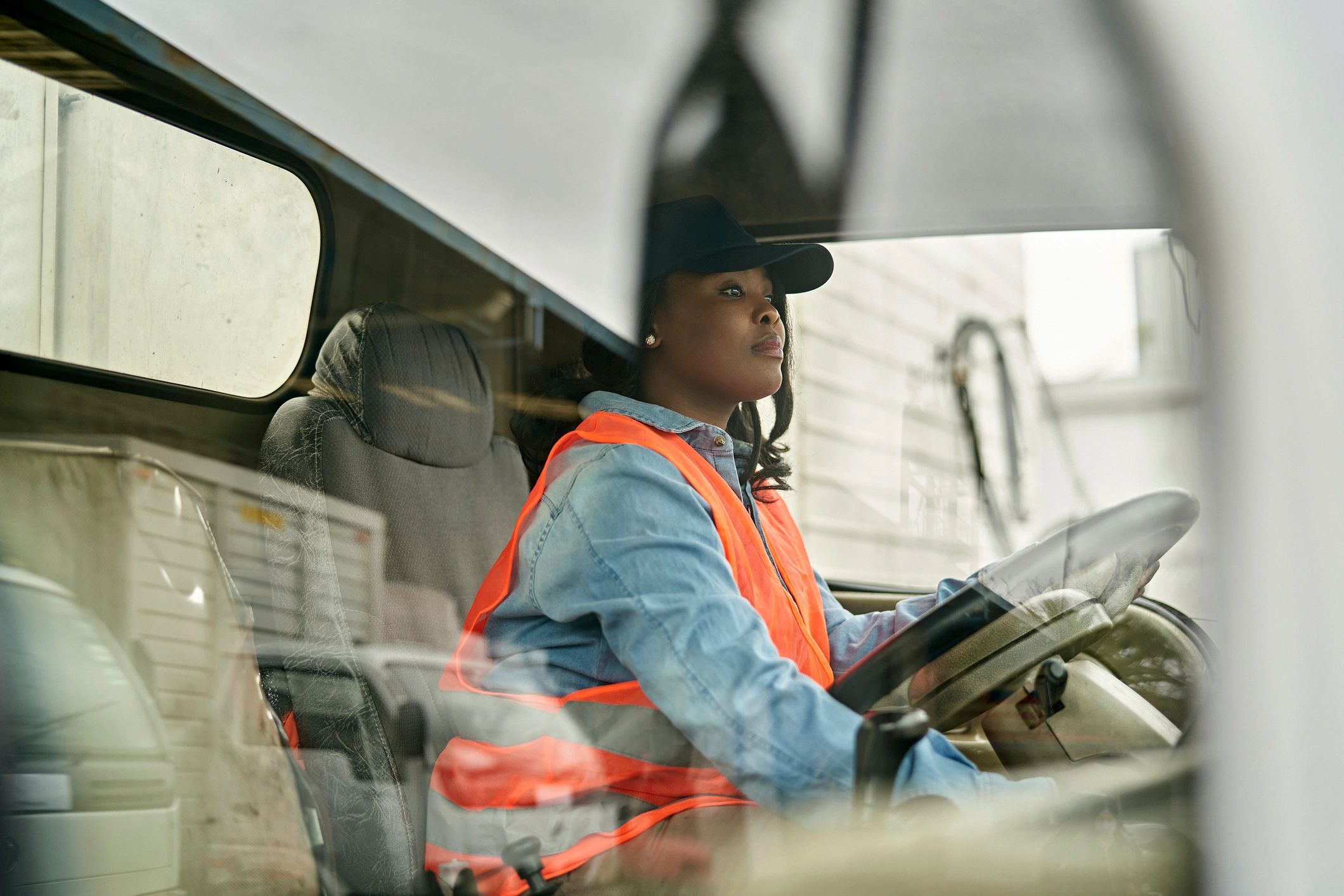 Truck driver seated in the cab, ready to drive