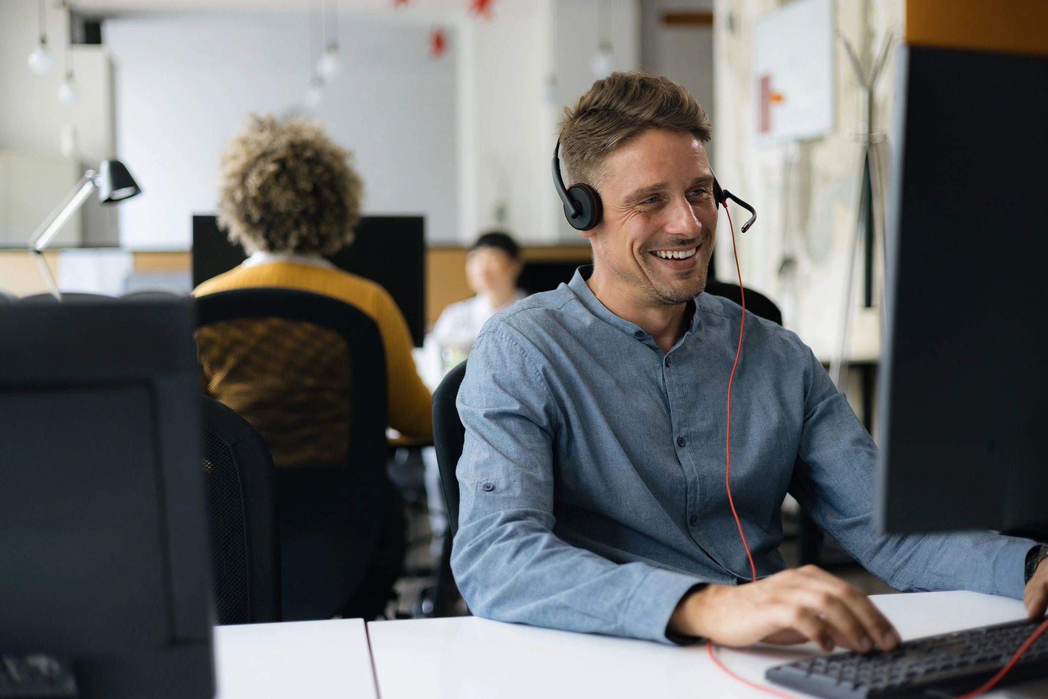 Recruiter speaking with a candidate using a headset